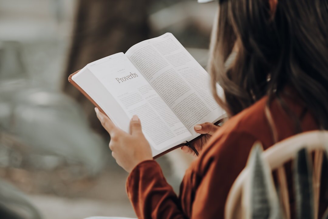 person reading old book
